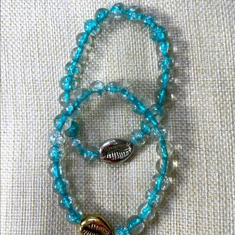 Best friend bracelet set with friend and silver Puka shell charms.